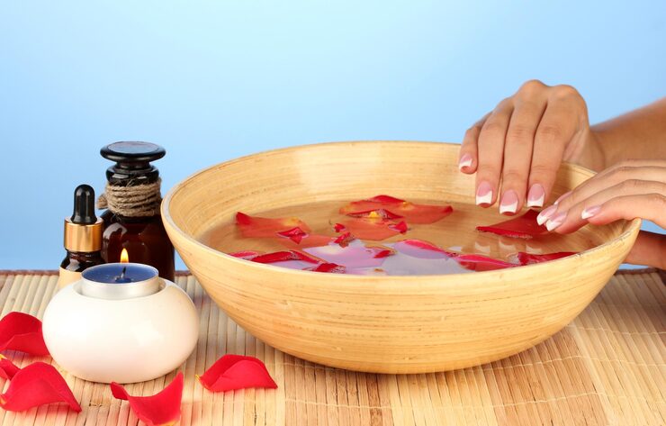 spa-treatments-female-hands-blue-background_392895-94640